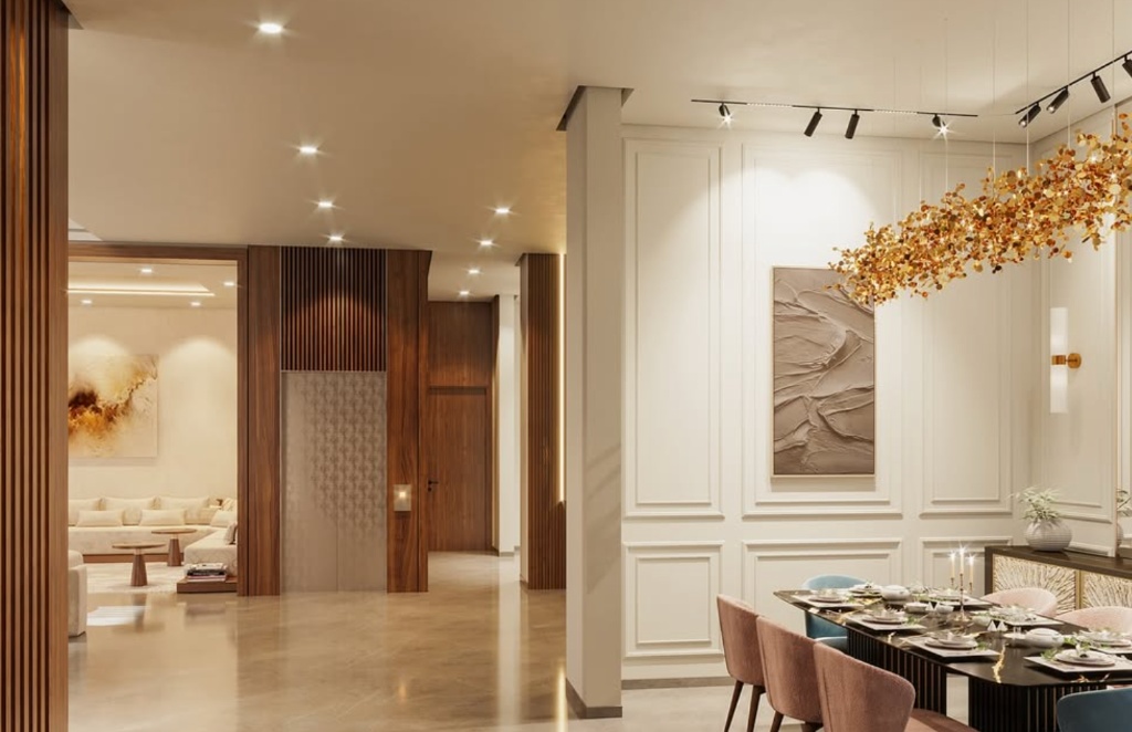 Salle à manger livrée par AZ Home Design : boiseries blanches, lustre branches dorées et lambris bois